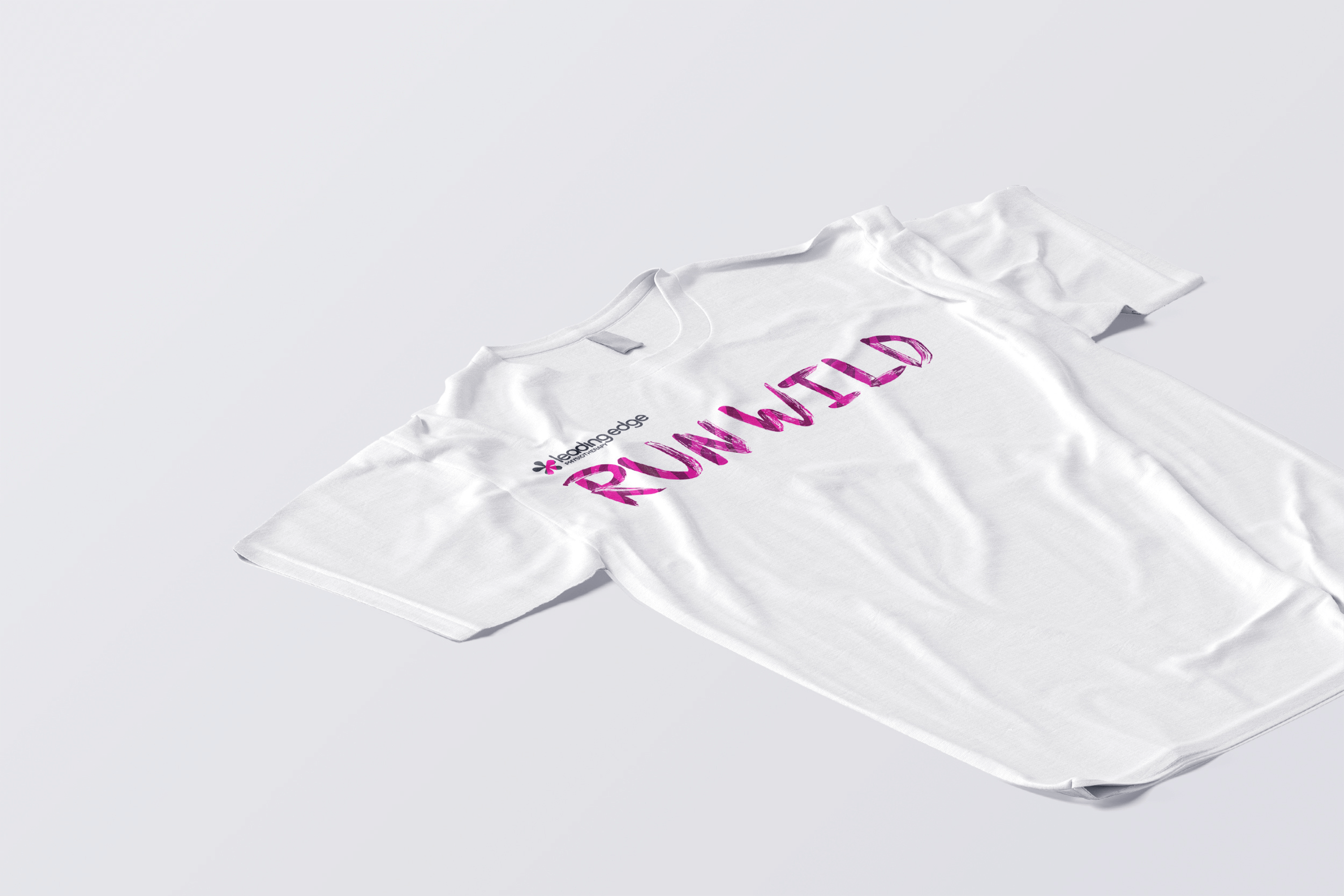 A white t-shirt with the the stylized Run Wild logo on it